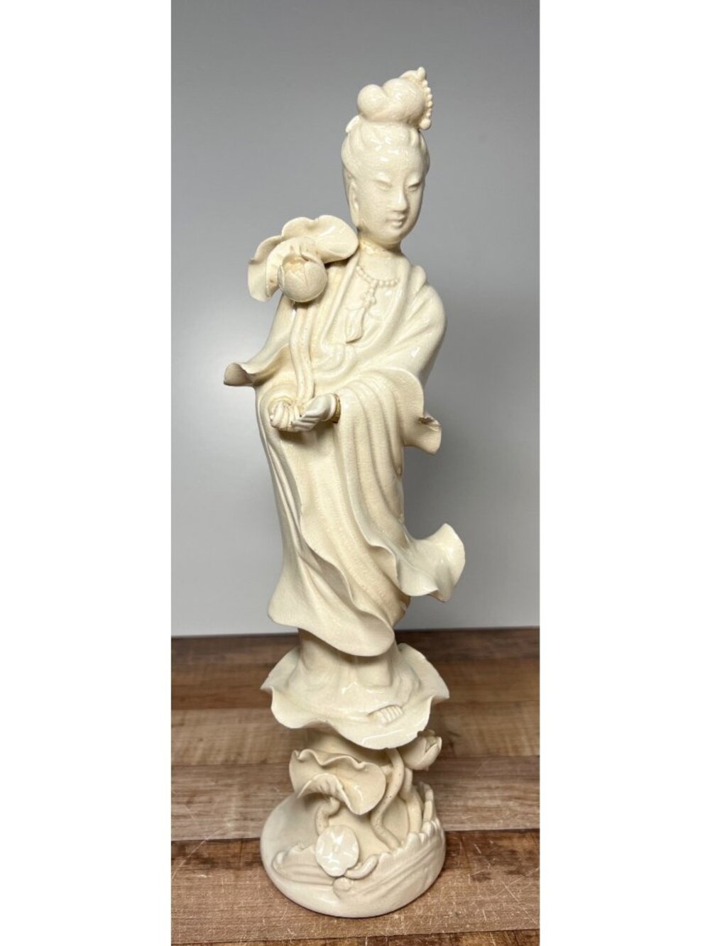 Porcelain Guanyin Figurine With Lotus Flowers Glossy Ivory Finish Elegant